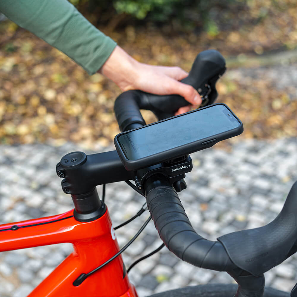 A cycling using the StrideCharge on his bicycle