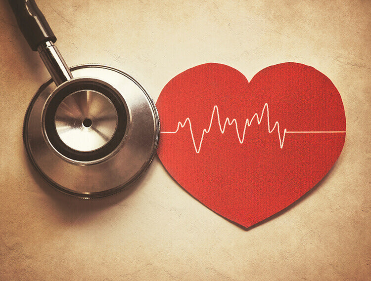 A stethoscope and a picture of a heart